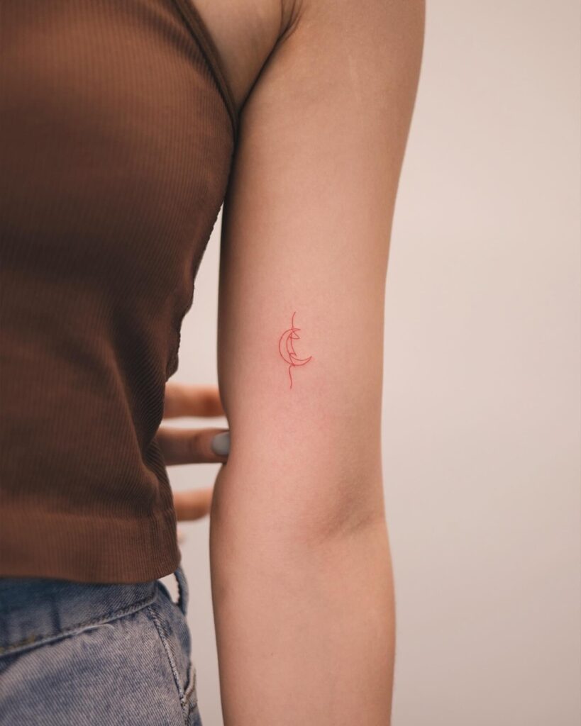 Red Ink Crescent Moon Tattoo meaningful tiny tattoos tattoo