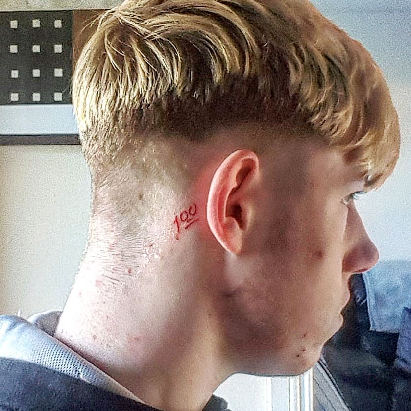 Red Ink “100” Emoji Behind the Ear behind the ear tattoo ideas for men tattoo
