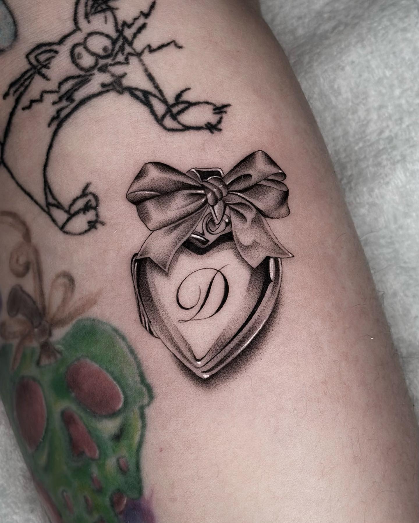 Rose And Name Locket Tattoo