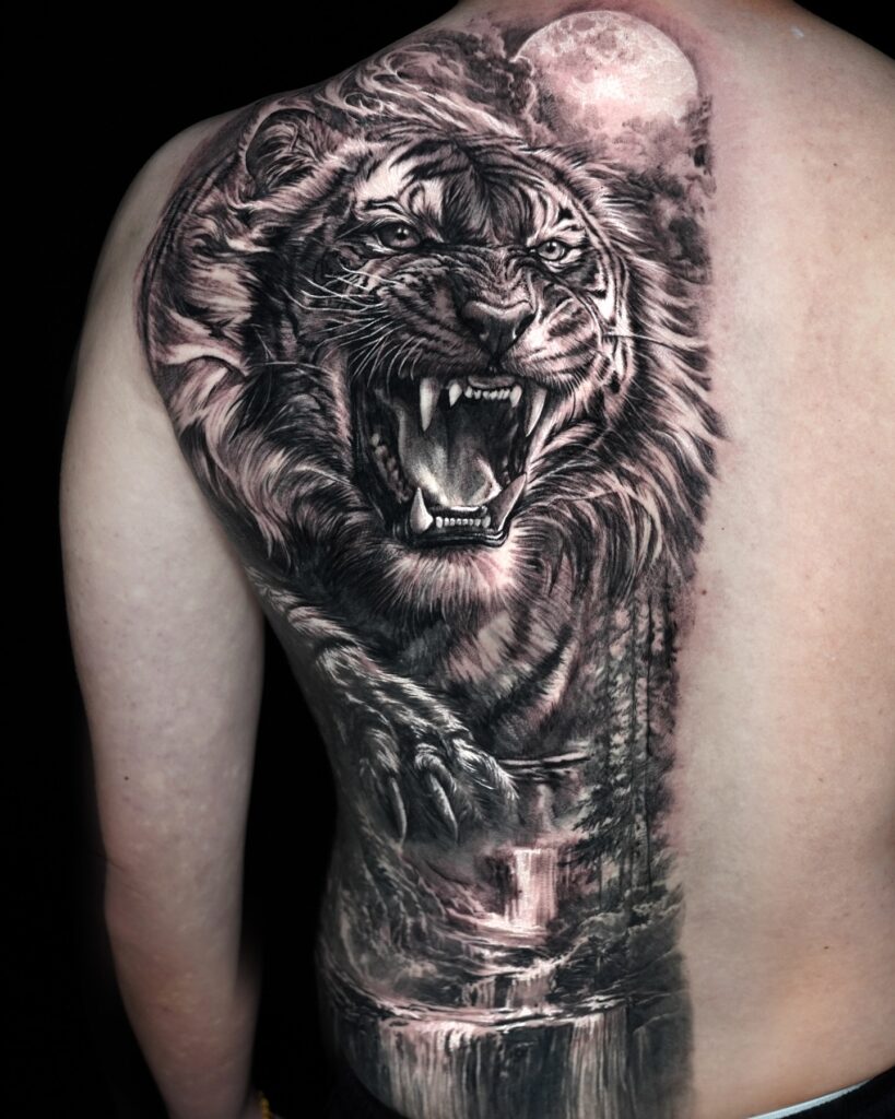 Roaring Tiger Back Tattoo with Moonlit Waterfall Scene back tattoos for guys tattoo