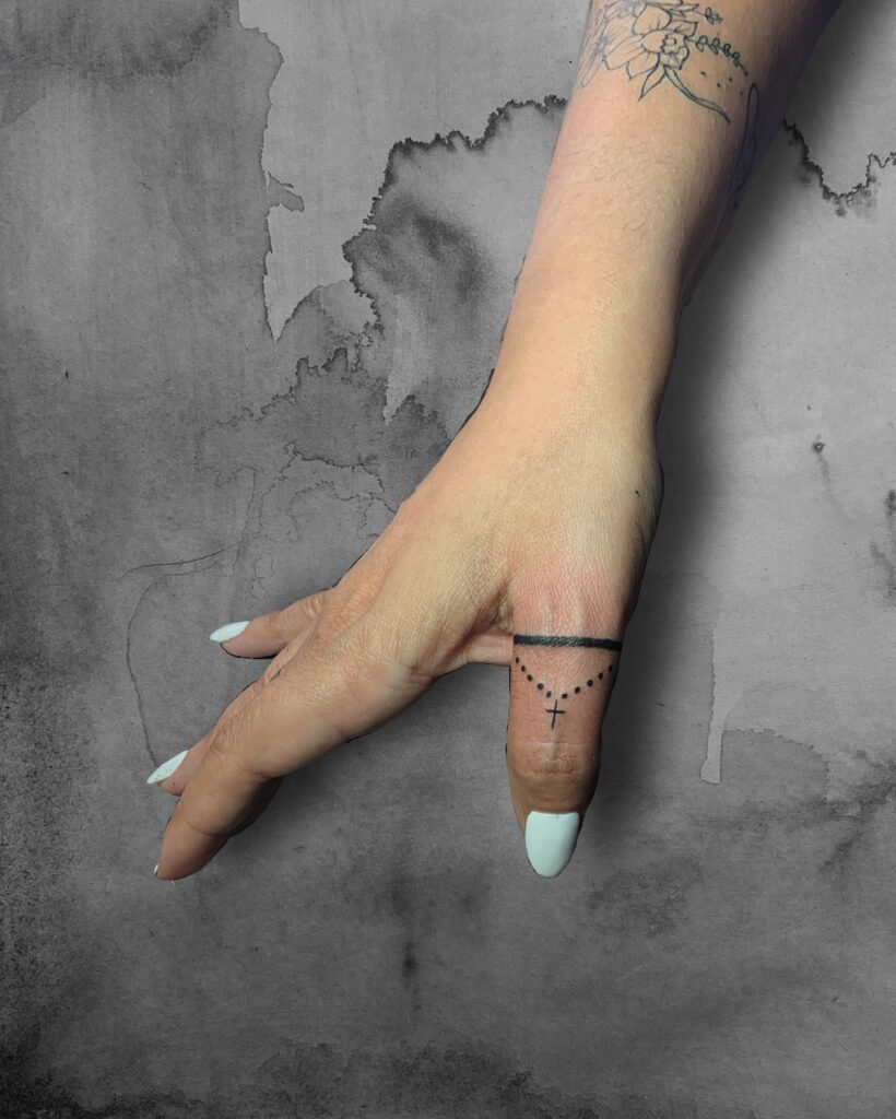 Starburst And Dot Finger Tattoos