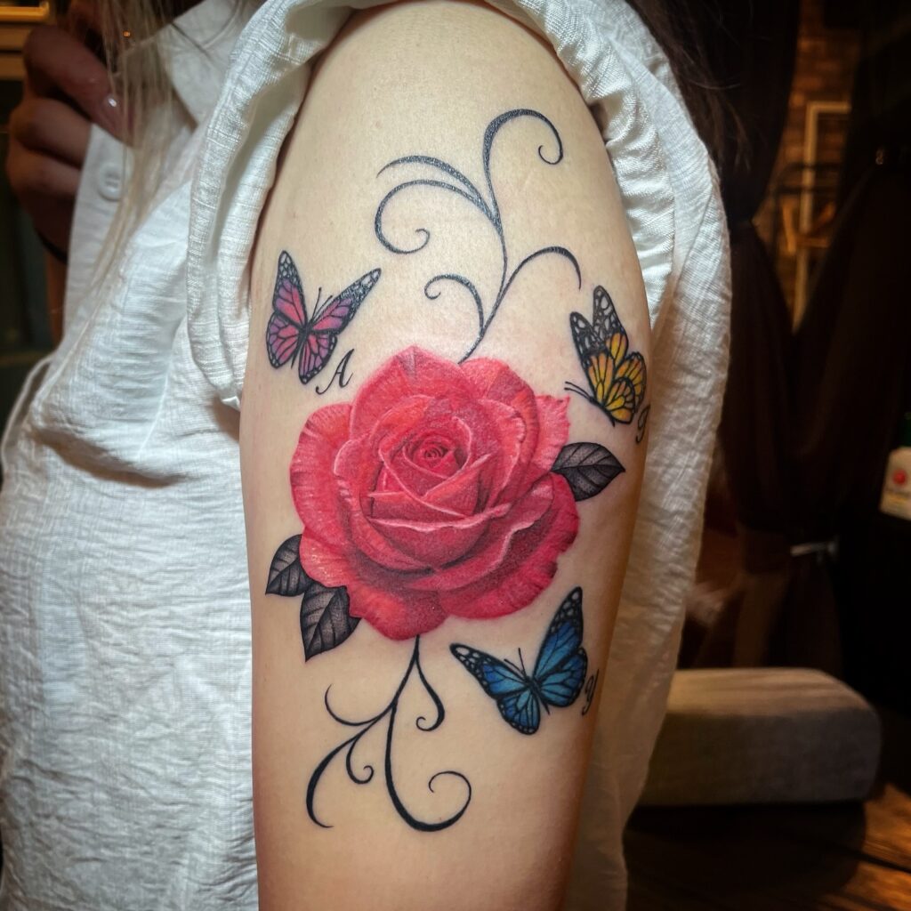Rose and Butterflies Tattoo on Upper Arm rose tattoos for women tattoo