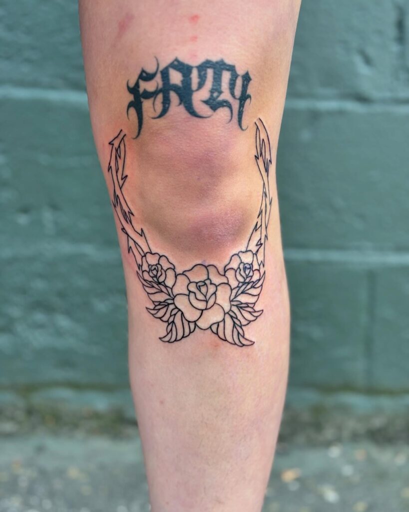 Ornamental Knee Frame With Flowing Lines Tattoo Design