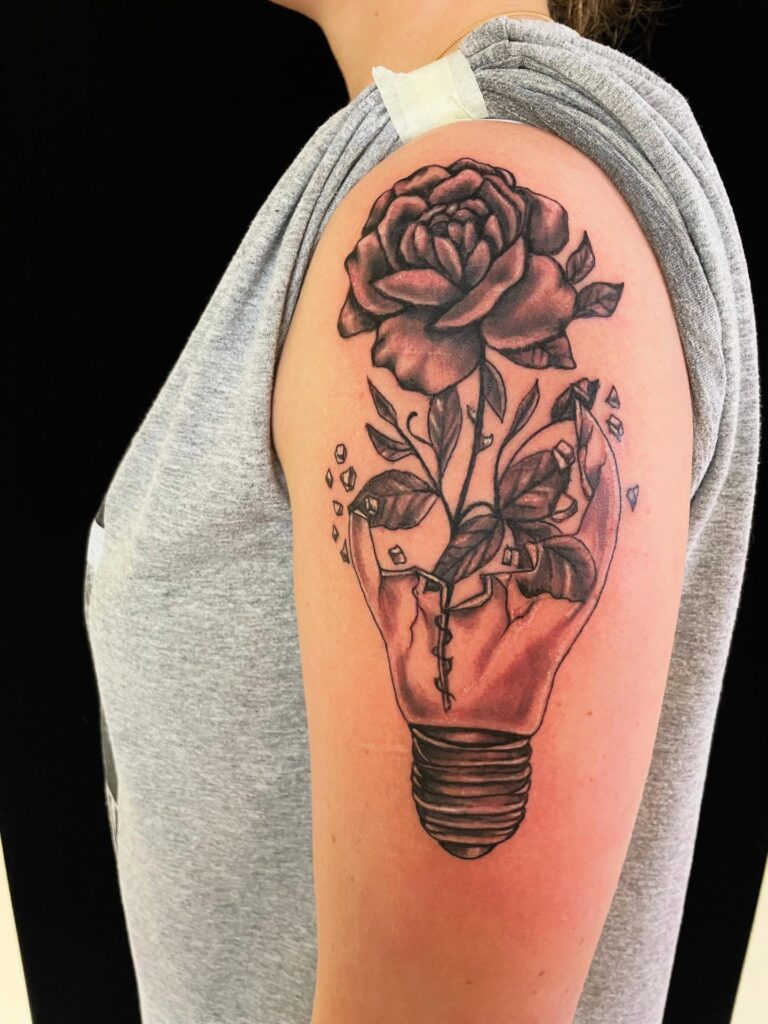 Rose Growing from Broken Light Bulb Tattoo rose tattoos for women tattoo