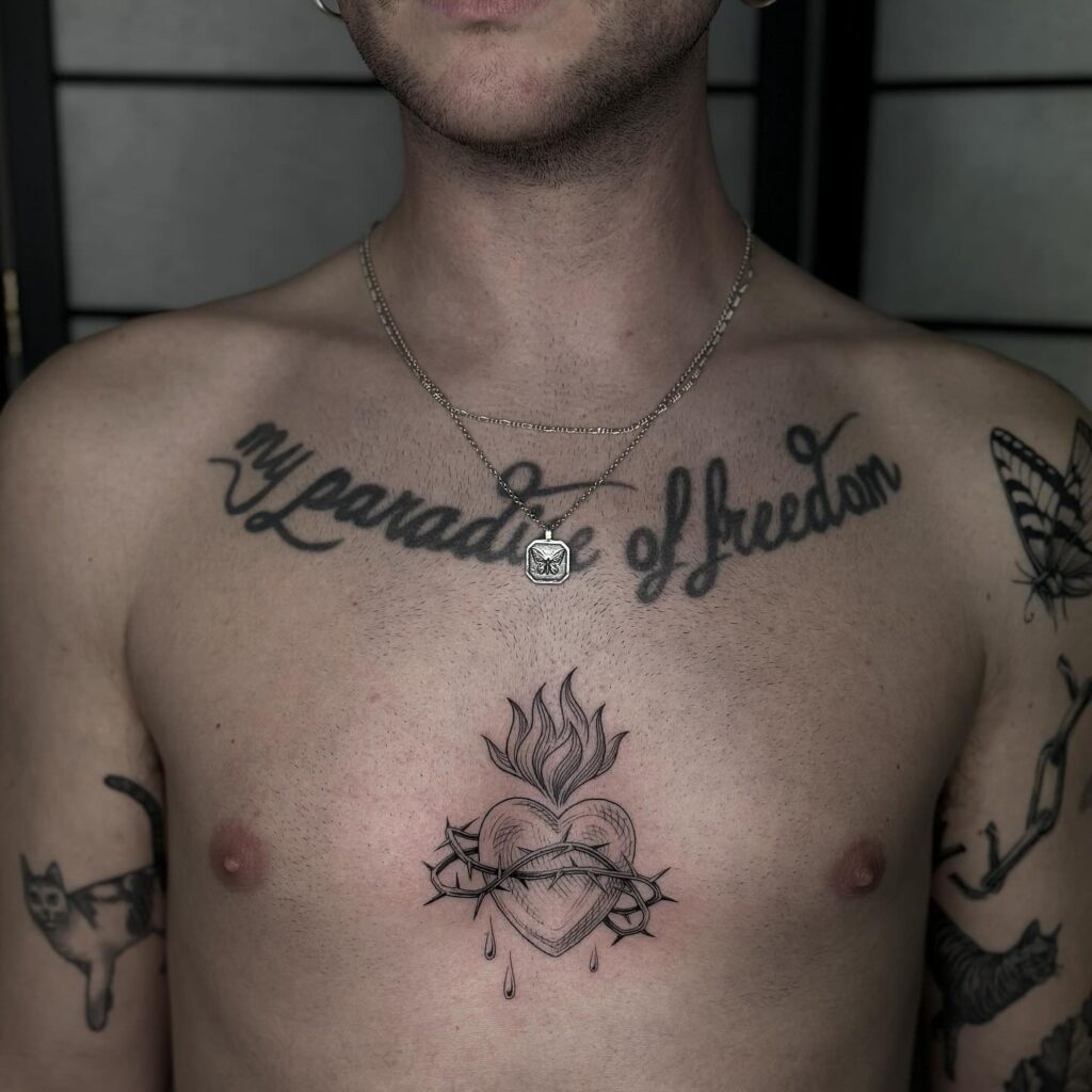 Dual Sacred Heart Designs Tattoos with Barbed Wire and Swords sacred heart tattoo ideas tattoo
