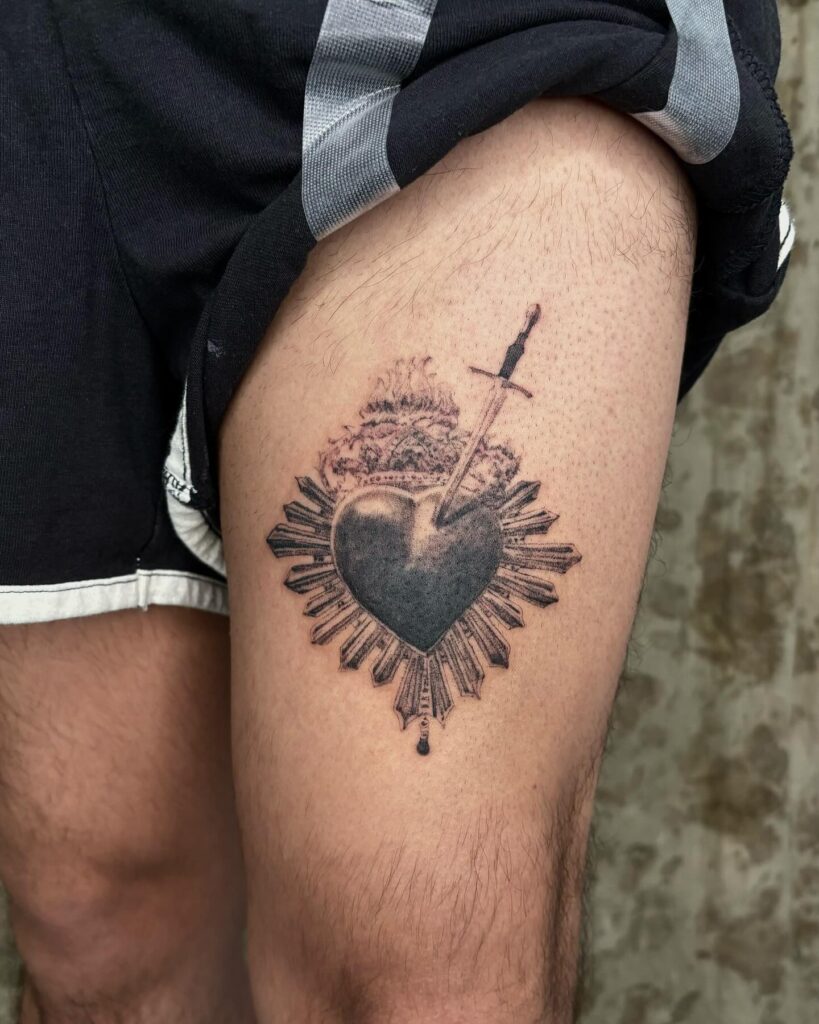 Traditional Sacred Heart Tattoo with Flowers and Flames sacred heart tattoo ideas tattoo