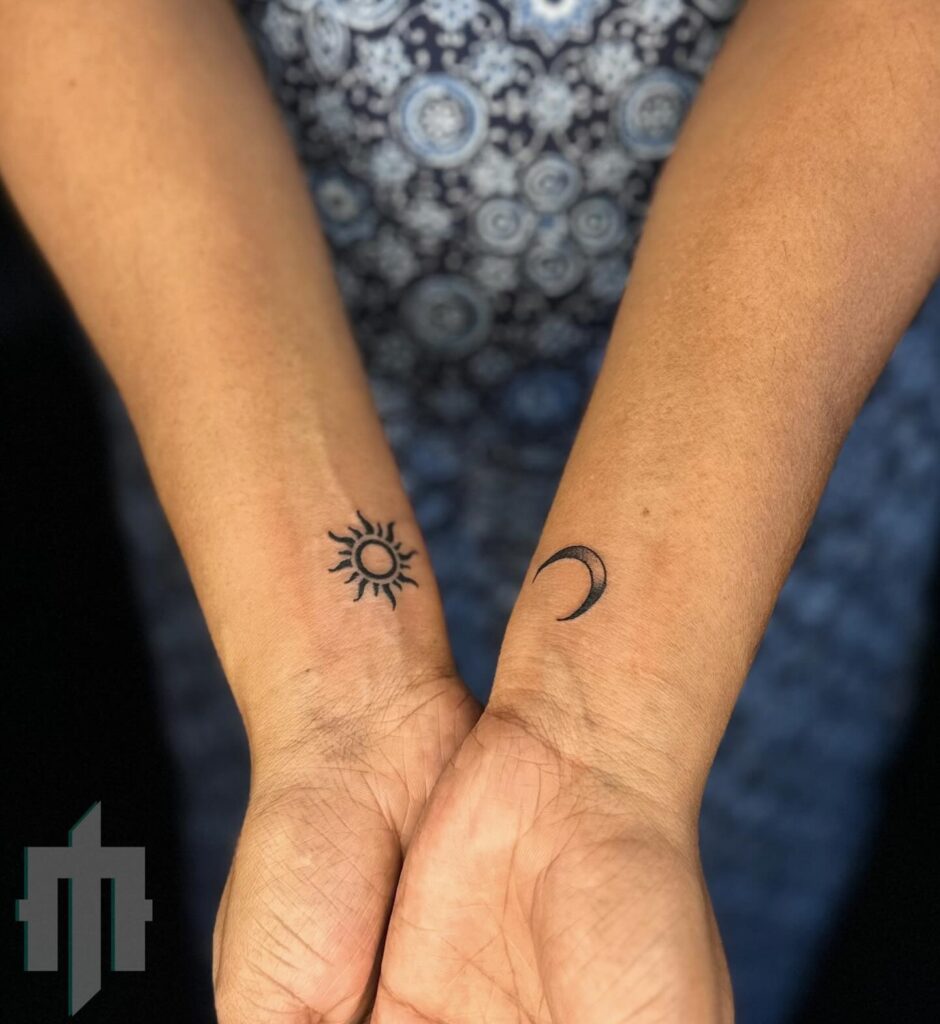 Simple black sun and moon wrist tattoos
