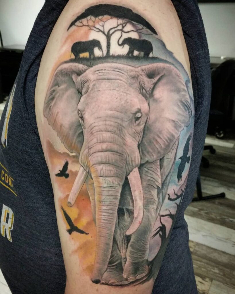 Majestic elephant savannah sunset tattoo