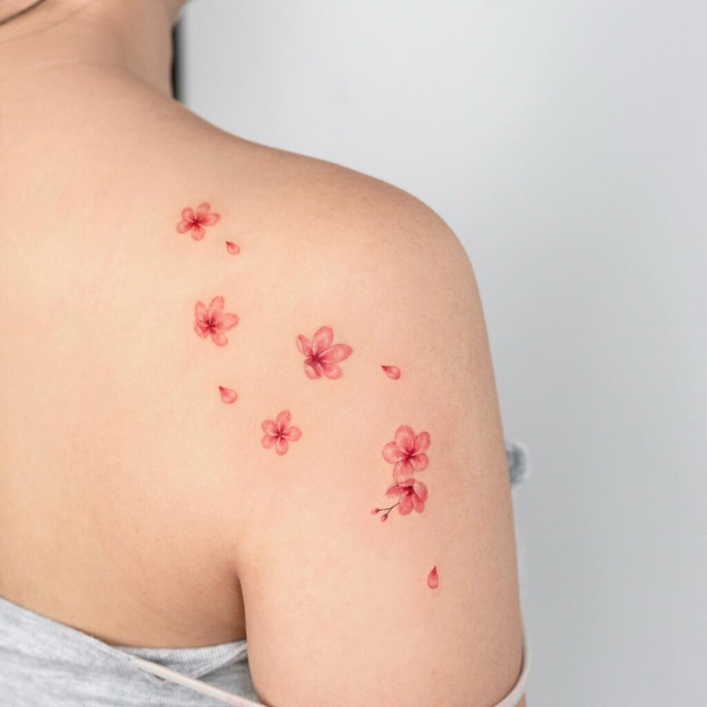 Scattered Cherry Blossoms Shoulder Tattoo cherry blossom tattoo ideas tattoo