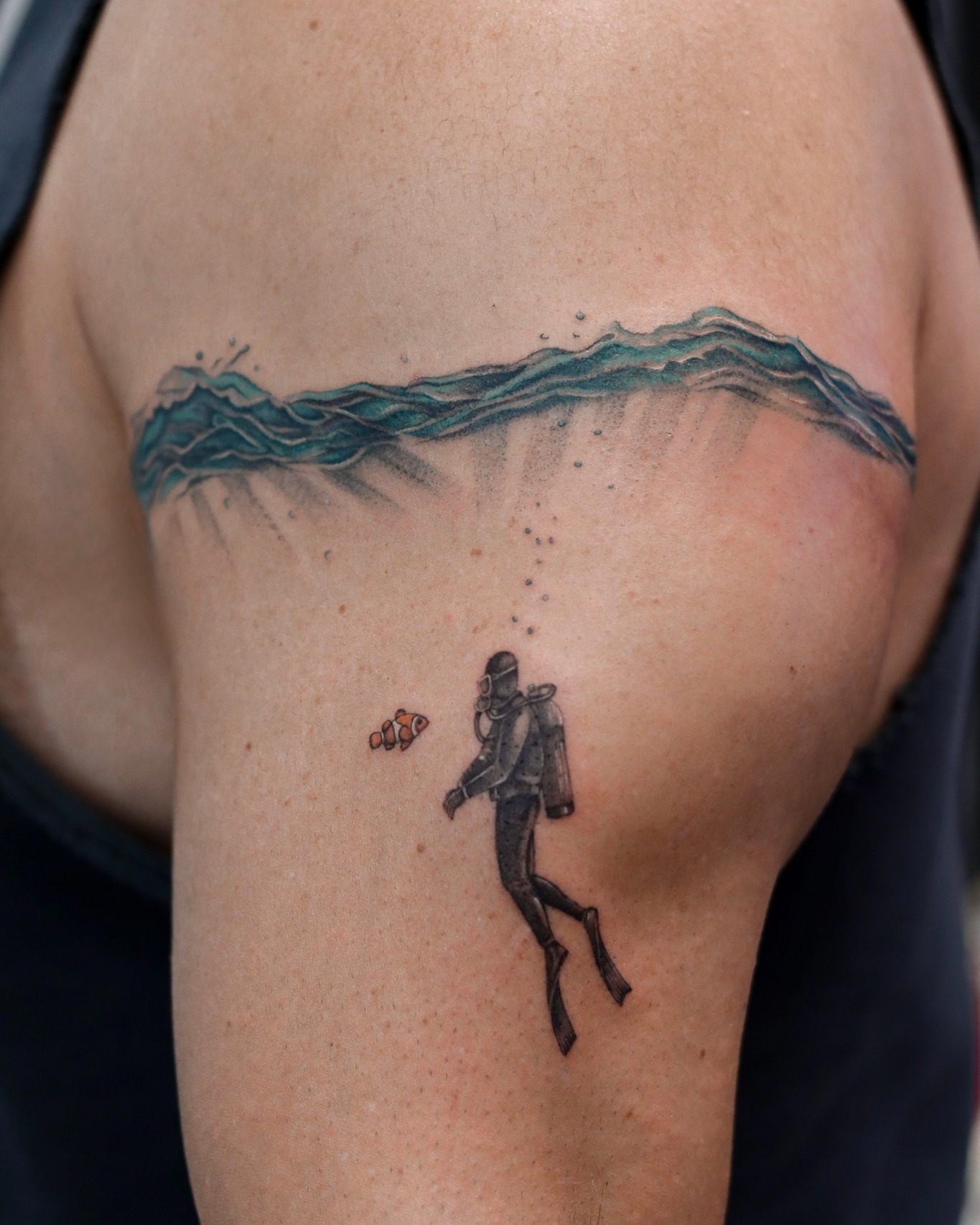 Scuba Diver and Inquisitive Clownfish ocean tattoo