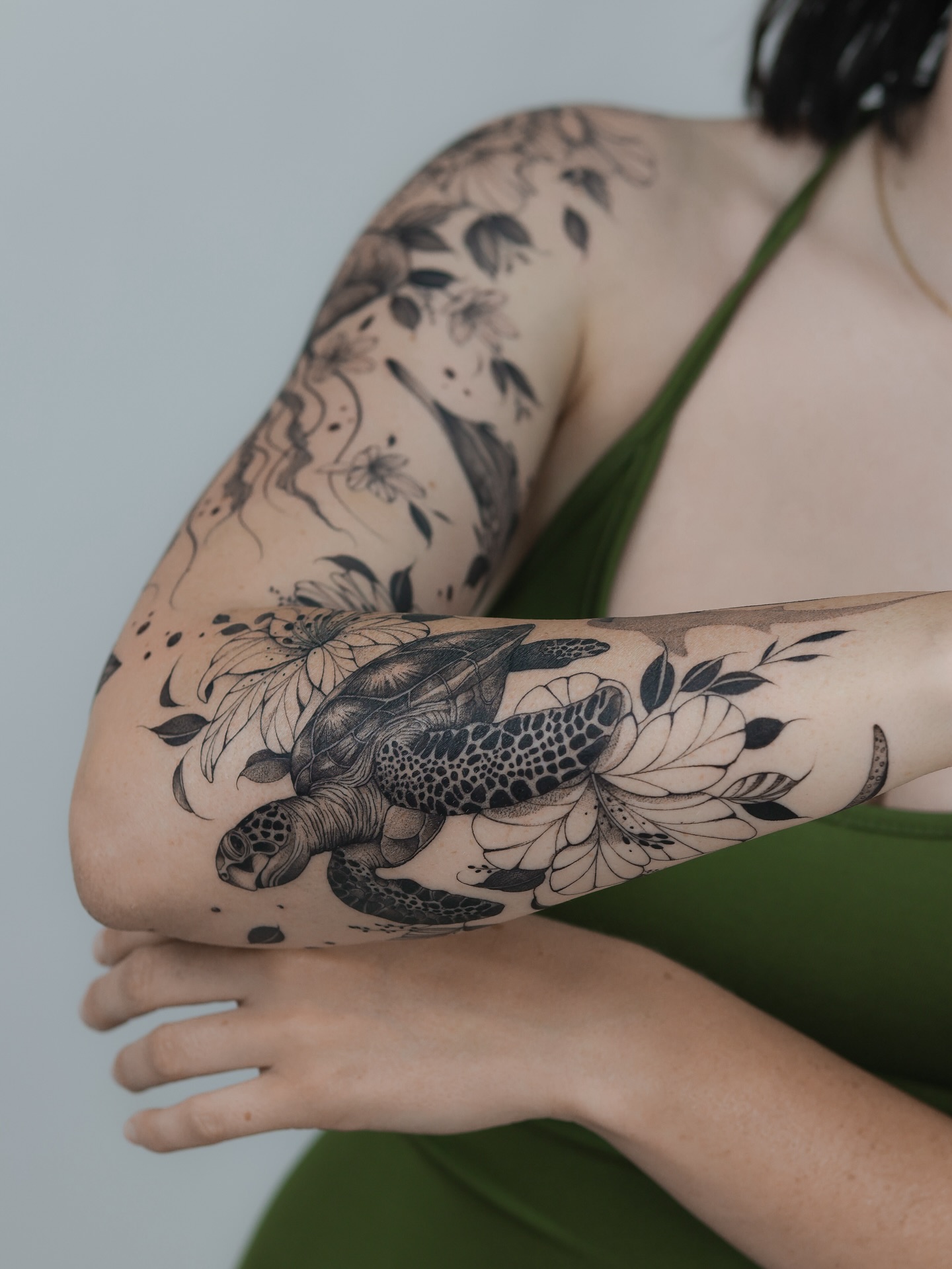 Sea Turtle Gliding Through Floating Hibiscus ocean tattoo