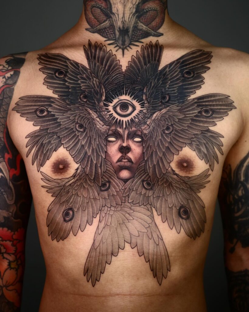 Seraphim Chest Tattoo with Radiant Eye and Divine Face seraphim angel tattoo ideas tattoo
