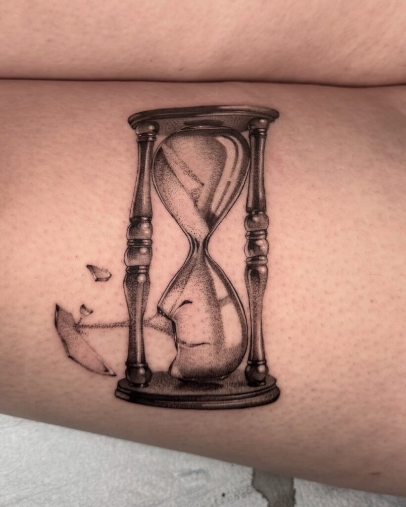 Shattered Glass Hourglass Thigh Tattoo hourglass tattoo ideas tattoo