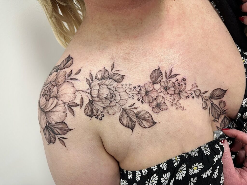 Shoulder-to-Collarbone Floral Garland Tattoo women shoulder flower tattoo ideas tattoo