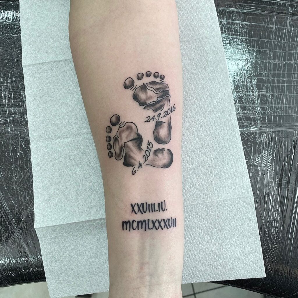 Sibling Baby Footprints with Dates Tattoo baby feet tattoos tattoo
