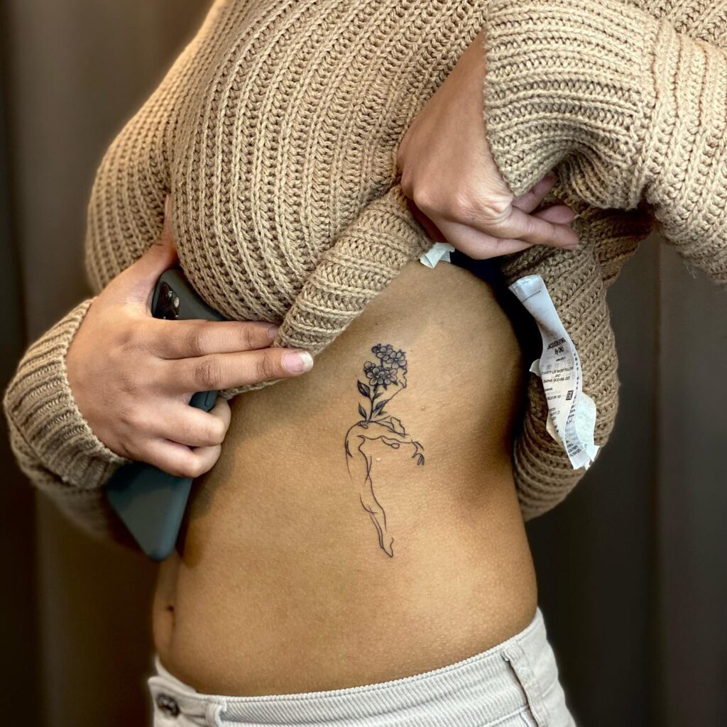 Small tattoo on the side ribcage