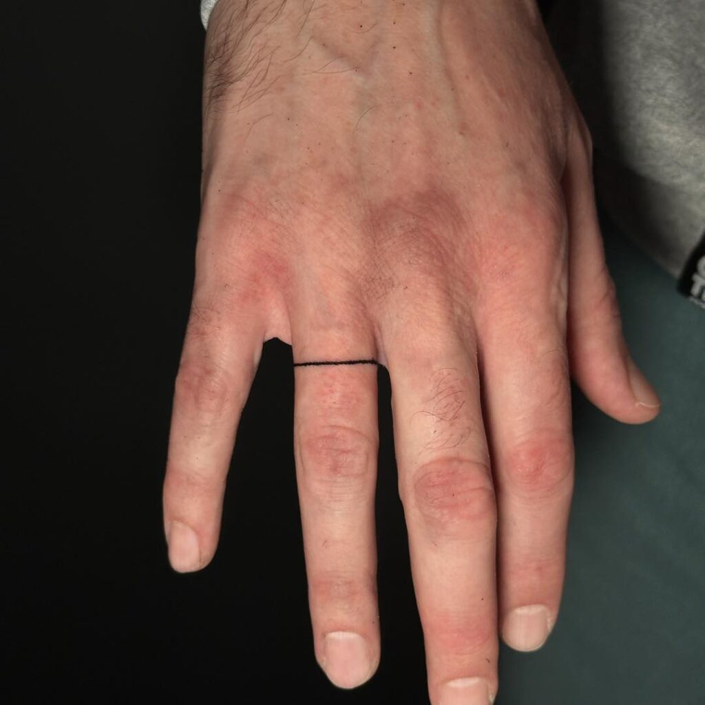 Bold Scorpion Finger Tattoo
