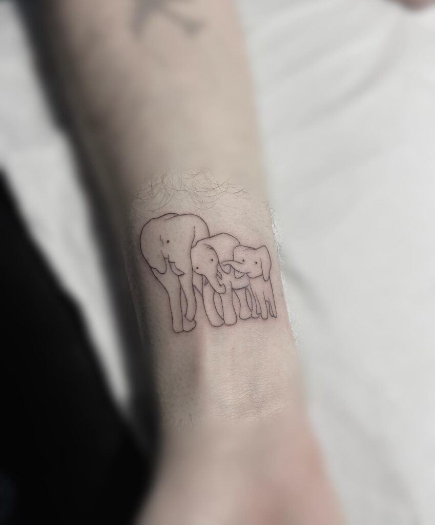 Simple Elephant Family Wrist Tattoo elephant family tattoo ideas tattoo