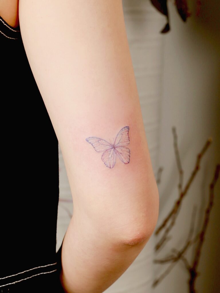 Simple Fine Line Butterfly on Inner Arm butterfly tattoo