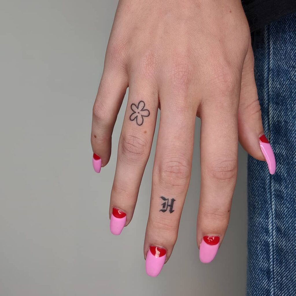 Symbol And Sun Finger Tattoos