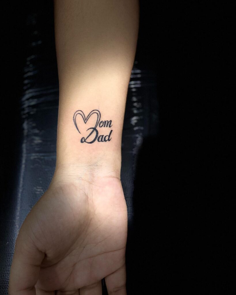 Simple Heart-Shaped Mom Dad Wrist Tattoo mom dad tattoos tattoo