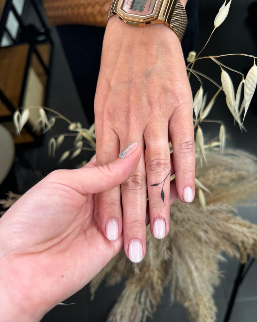 Red Bow Finger Tattoo