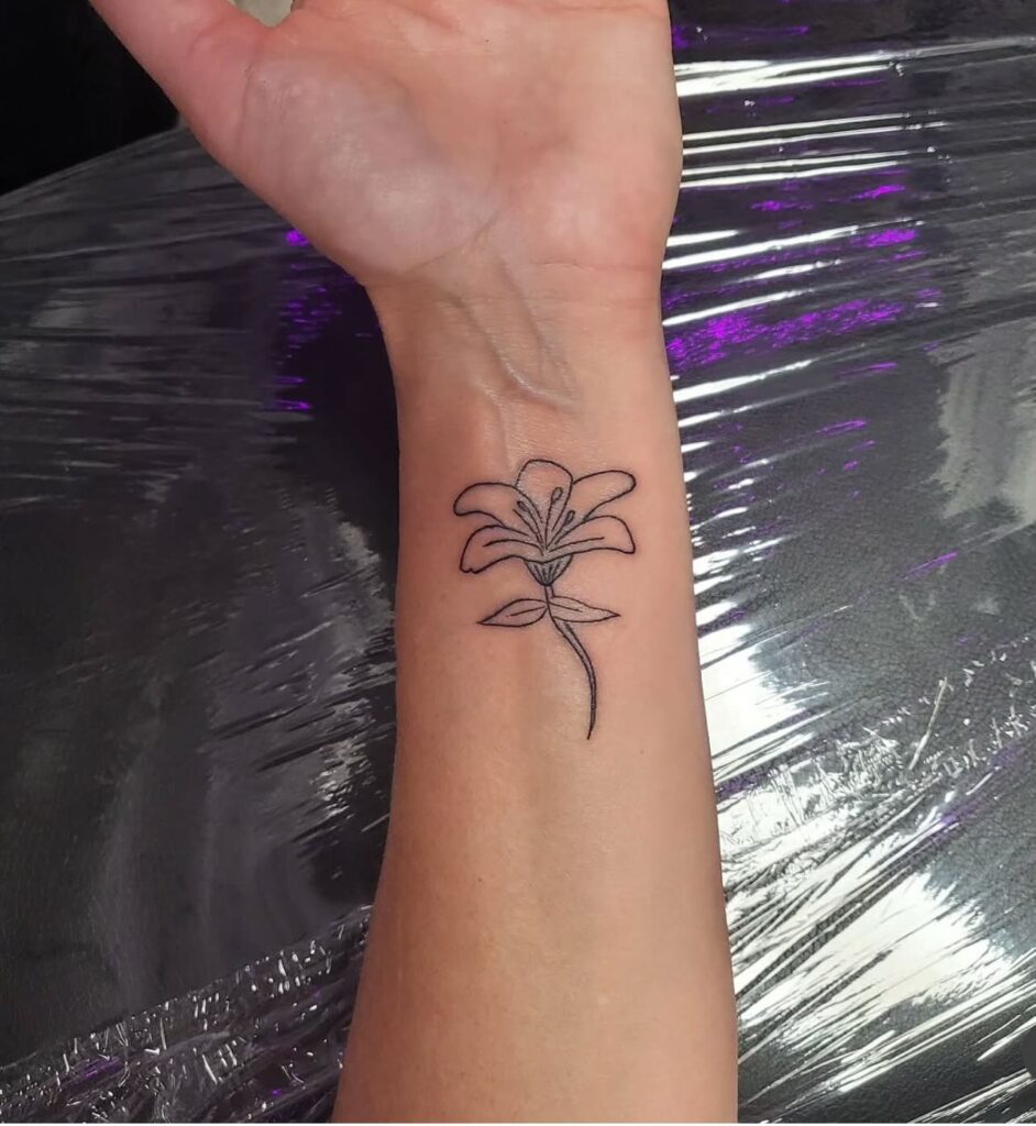 Simple Lily Linework Wrist Tattoo flower wrist tattoo ideas tattoo