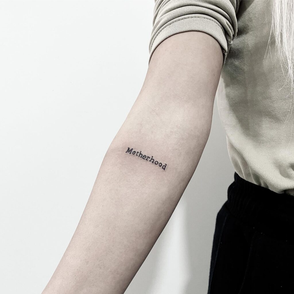 Simple Motherhood Script Tattoo mommy tattoo ideas tattoo