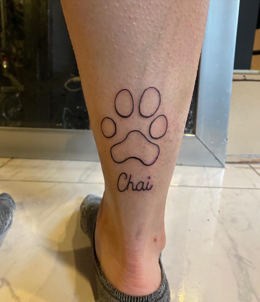 Simple Paw Print Outline Tattoo with Name paw print tattoo ideas tattoo