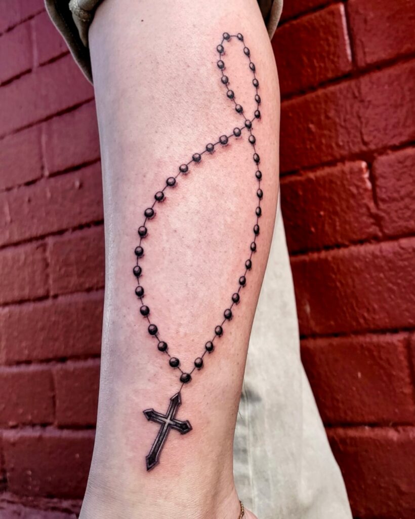 Held In Faith Rosary Tattoo