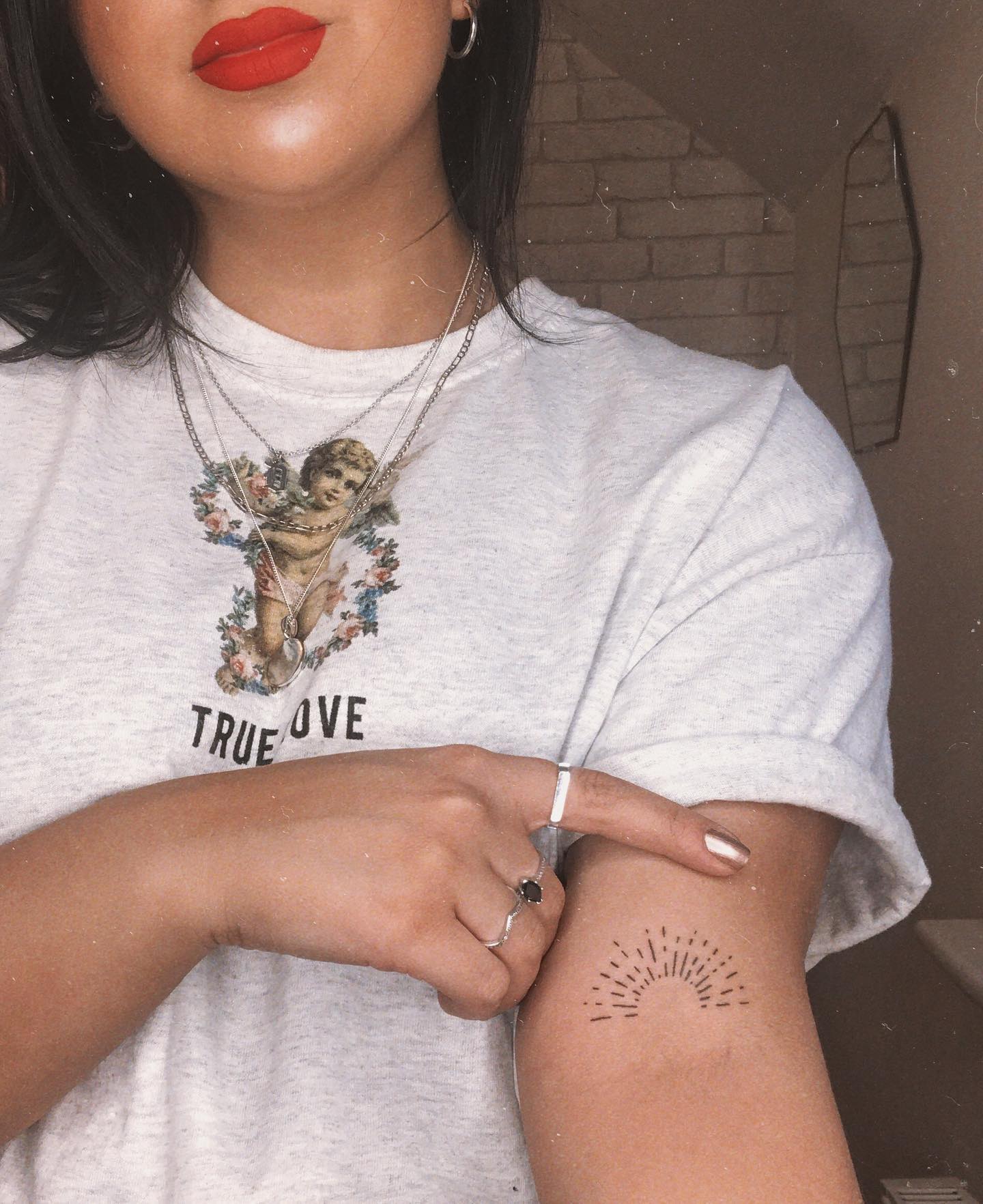 Single Needle Sunrise on Upper Bicep sunrise tattoo