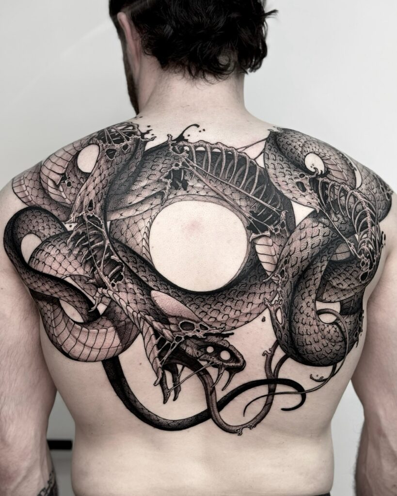 Skeletal Serpent Back Tattoo of Rebirth and Shadow back tattoos for guys tattoo