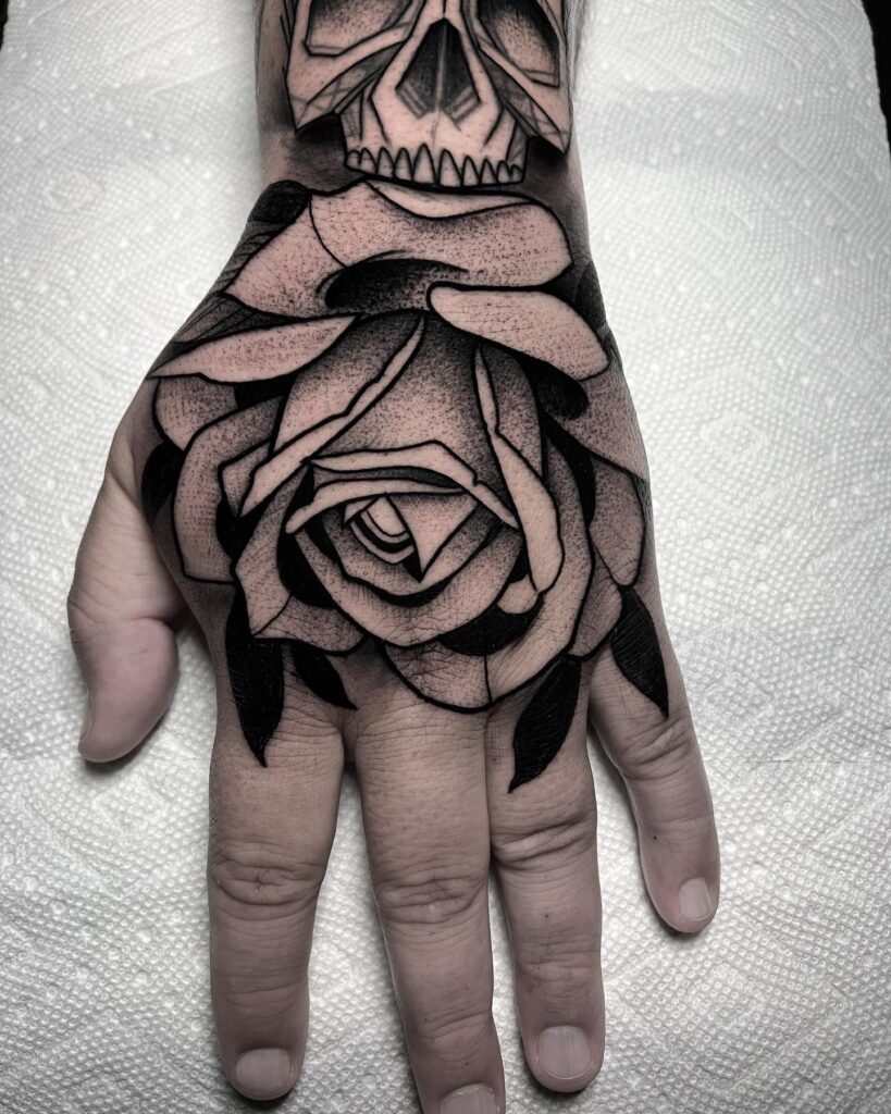 Skull and Rose Hand Tattoo hand tattoo ideas for guys tattoo