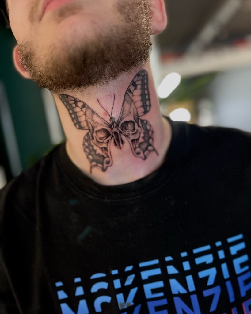 Bold WANTED Neck Tattoo With Stencil Style