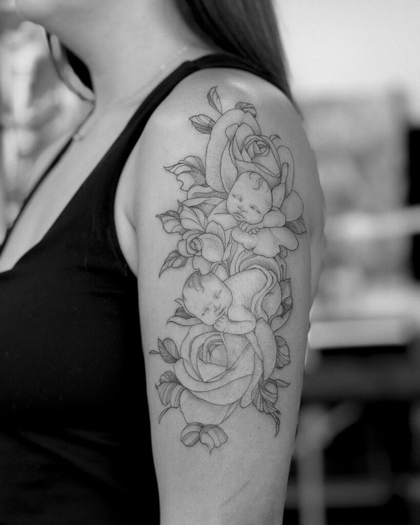Sleeping Babies Among Roses Tattoo mommy tattoo ideas tattoo