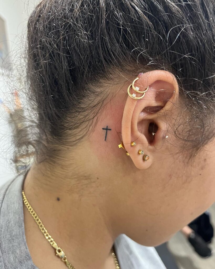 Minimalist Bow and Arrow Behind the Ear Tattoo behind the ear tattoos tattoo