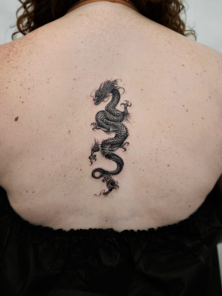 Small Dragon Outline Tattoo On Arm