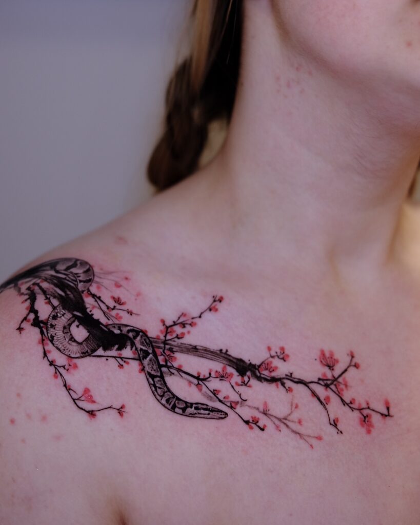 Snake and Cherry Blossom Collarbone Tattoo cherry blossom tattoo ideas tattoo