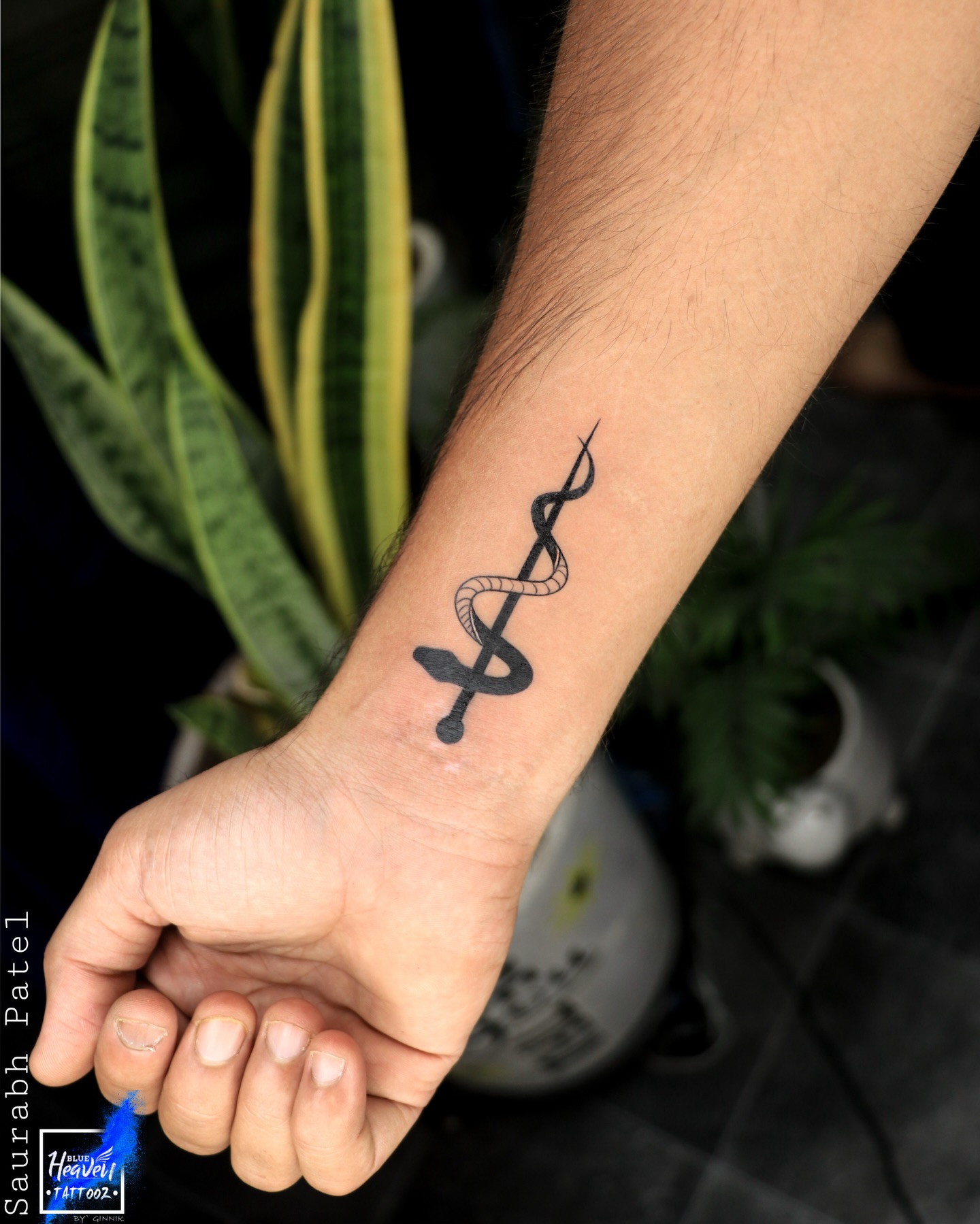 Snake and Sword Wrist Tattoo