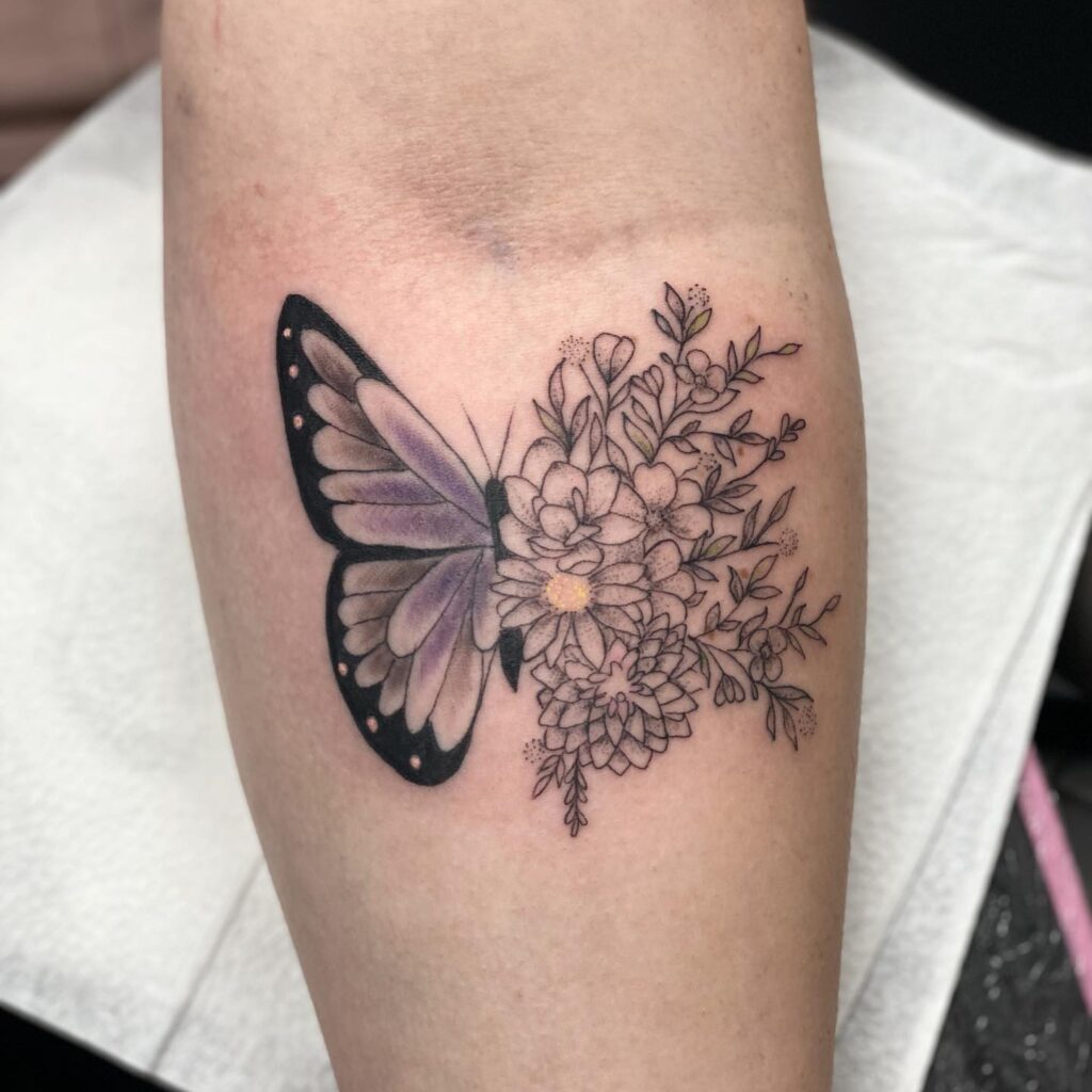 Soft Lavender Butterfly and Garden Blooms Tattoo half butterfly half flower tattoos tattoo