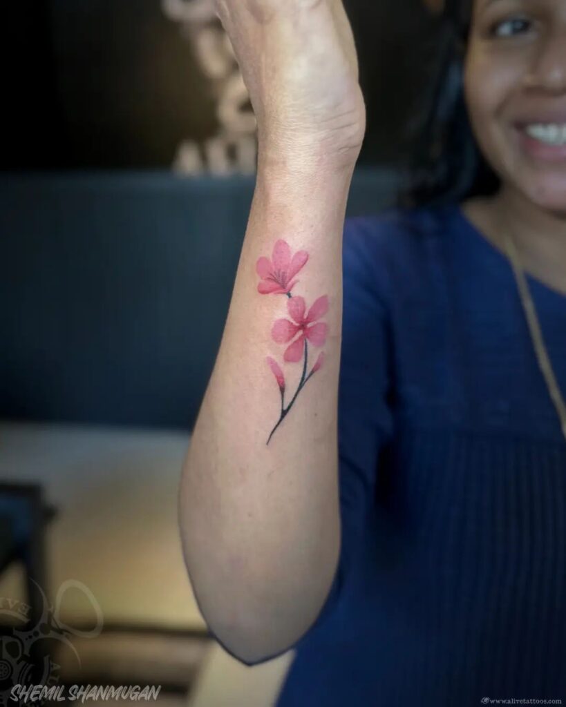 Soft Pink Blossom Wrist Tattoo flower wrist tattoo ideas tattoo