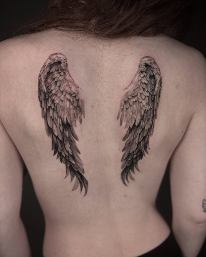 Soft Realism Angel Wings on Upper Back angel wings tattoo ideas on back tattoo