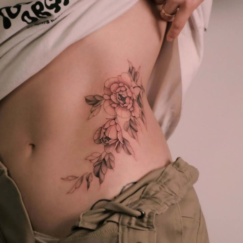 Soft Rose Tattoo on Ribcage rose tattoos for women tattoo
