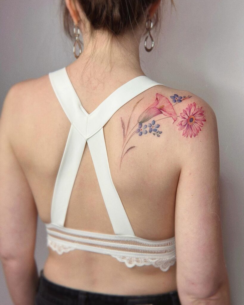 Soft Spring Blooms Shoulder Tattoo women shoulder flower tattoo ideas tattoo