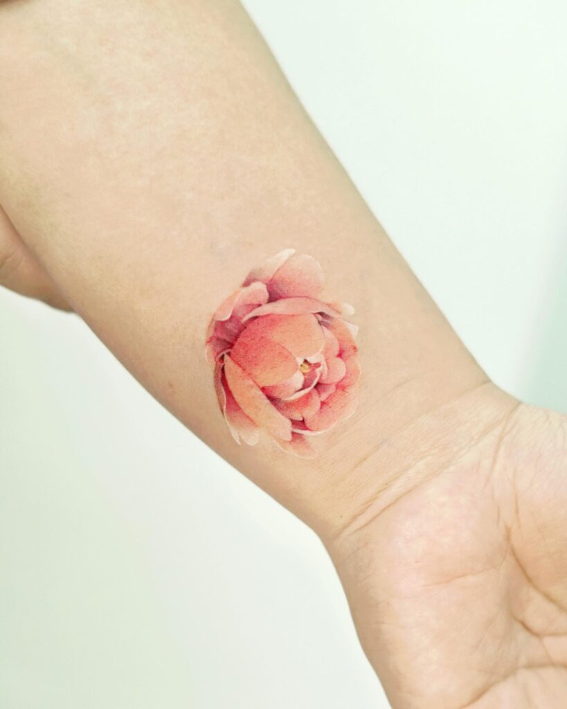 Soft Watercolor Peony Wrist Tattoo peony flower tattoo ideas tattoo
