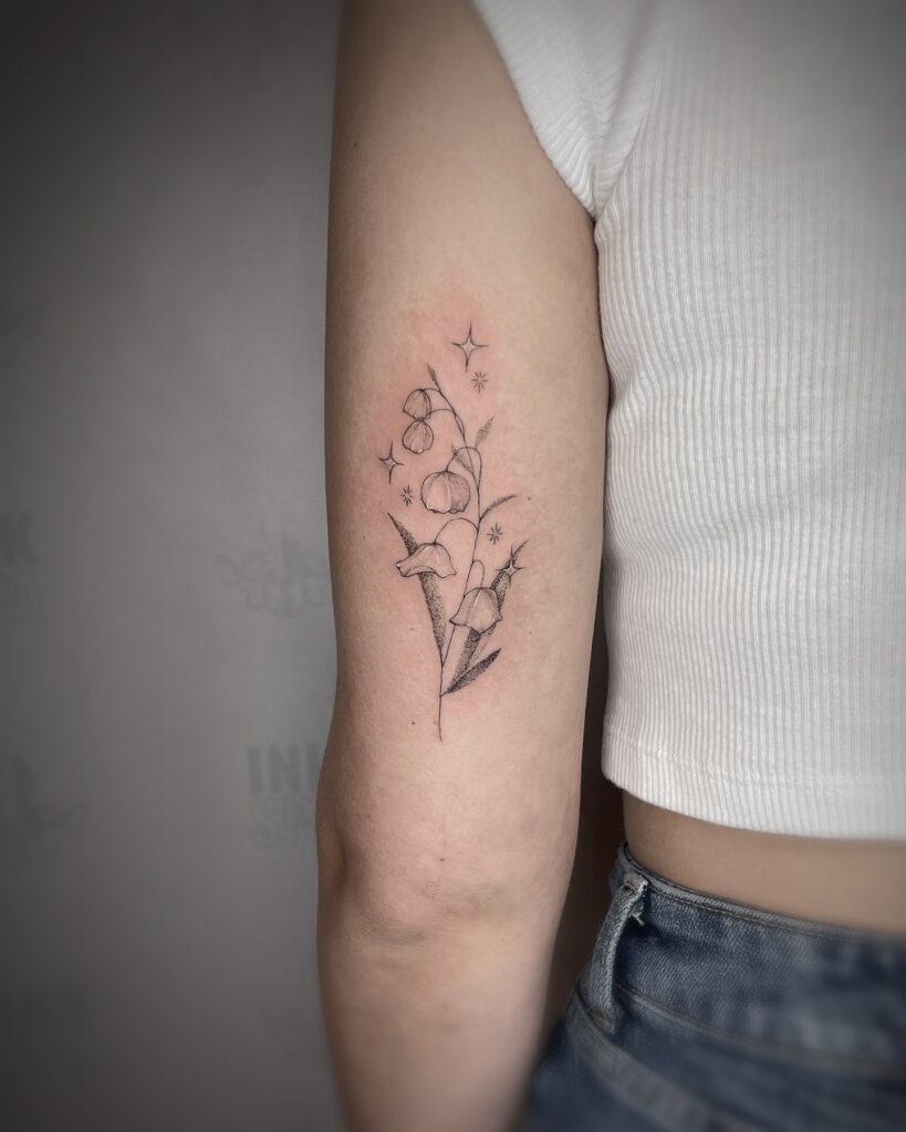 Sparkling Lily of the Valley Upper Arm Tattoo may birth flower tattoos tattoo
