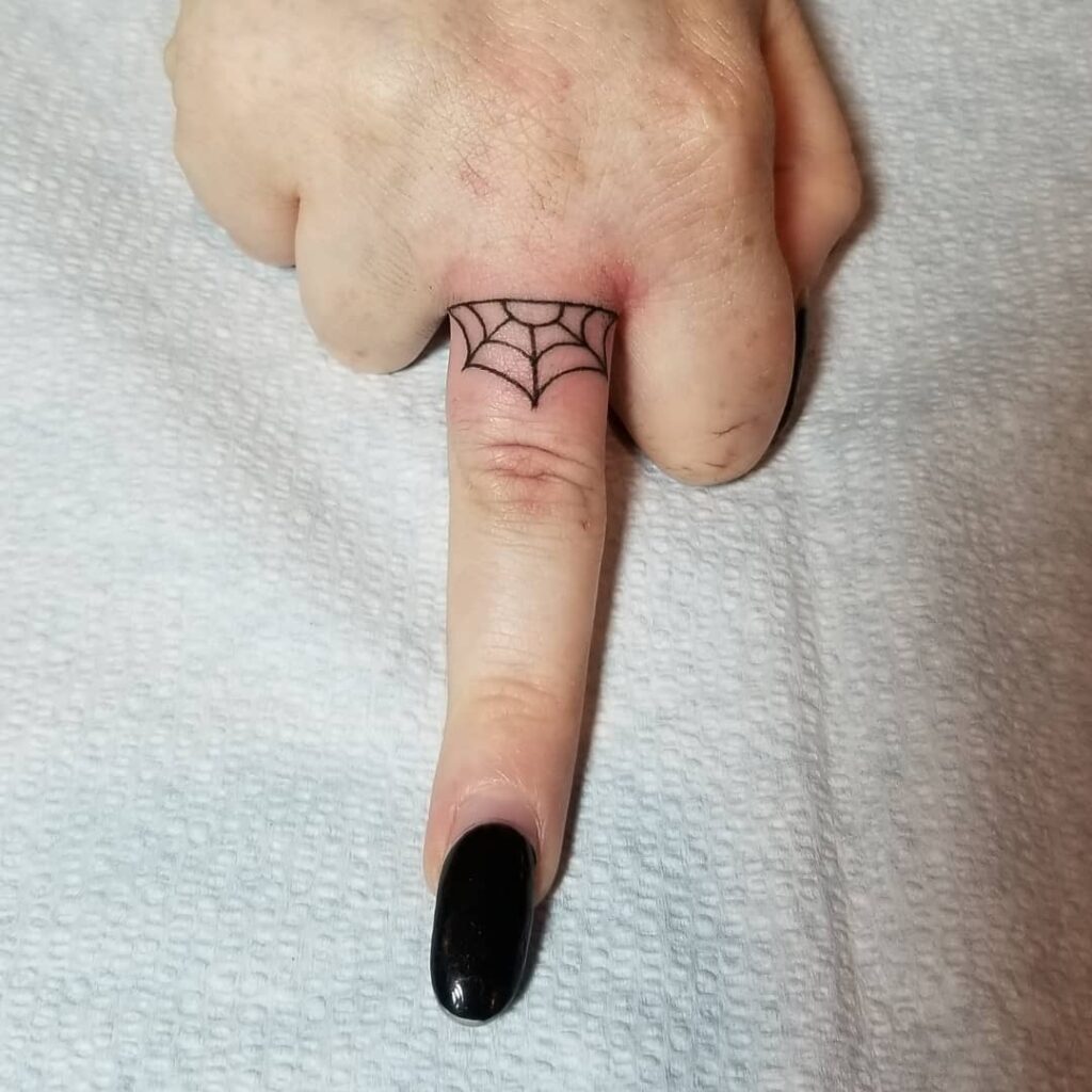 Tiny Minimalist Flower Finger Tattoo