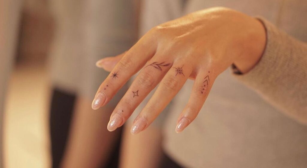 Overlapping Hearts Finger Tattoo