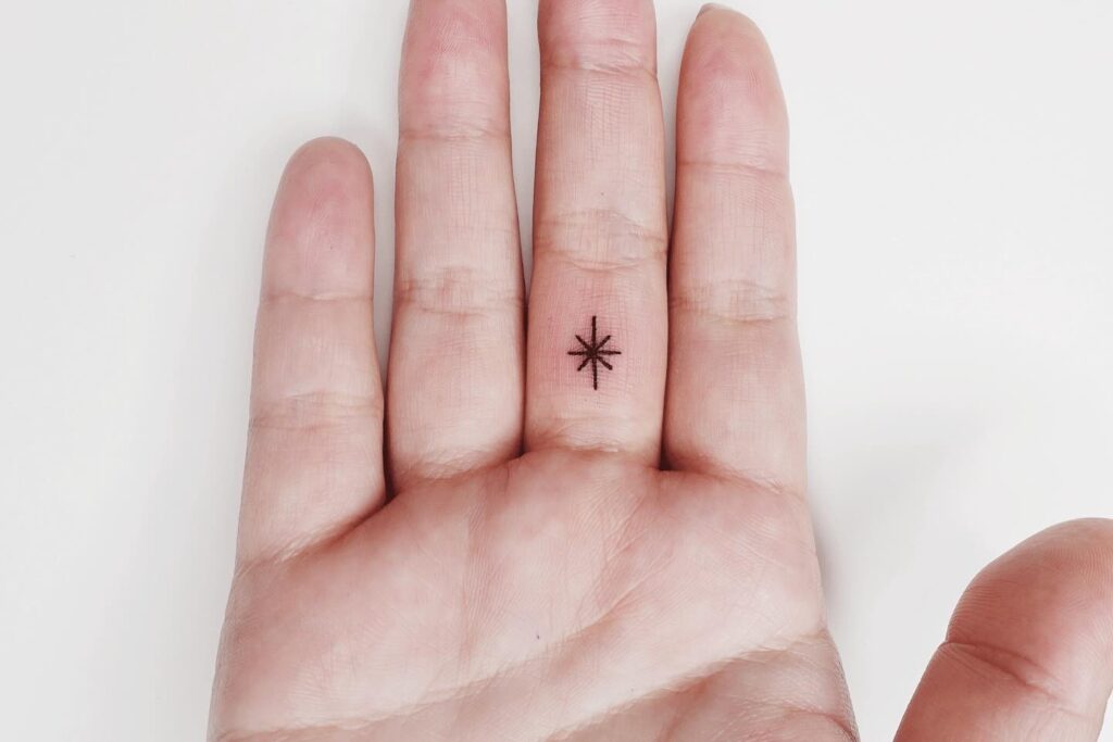 Ornamental Starburst Arm Tattoo