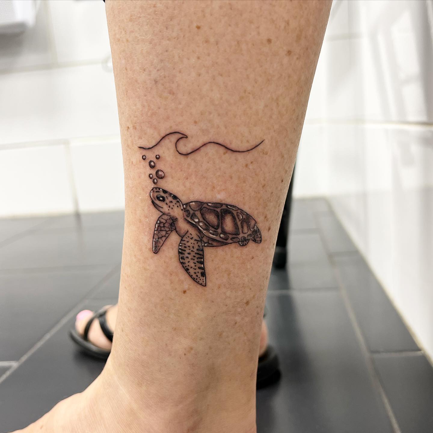 Swimming Turtle and Wave Tattoo small turtle tattoo ideas tattoo
